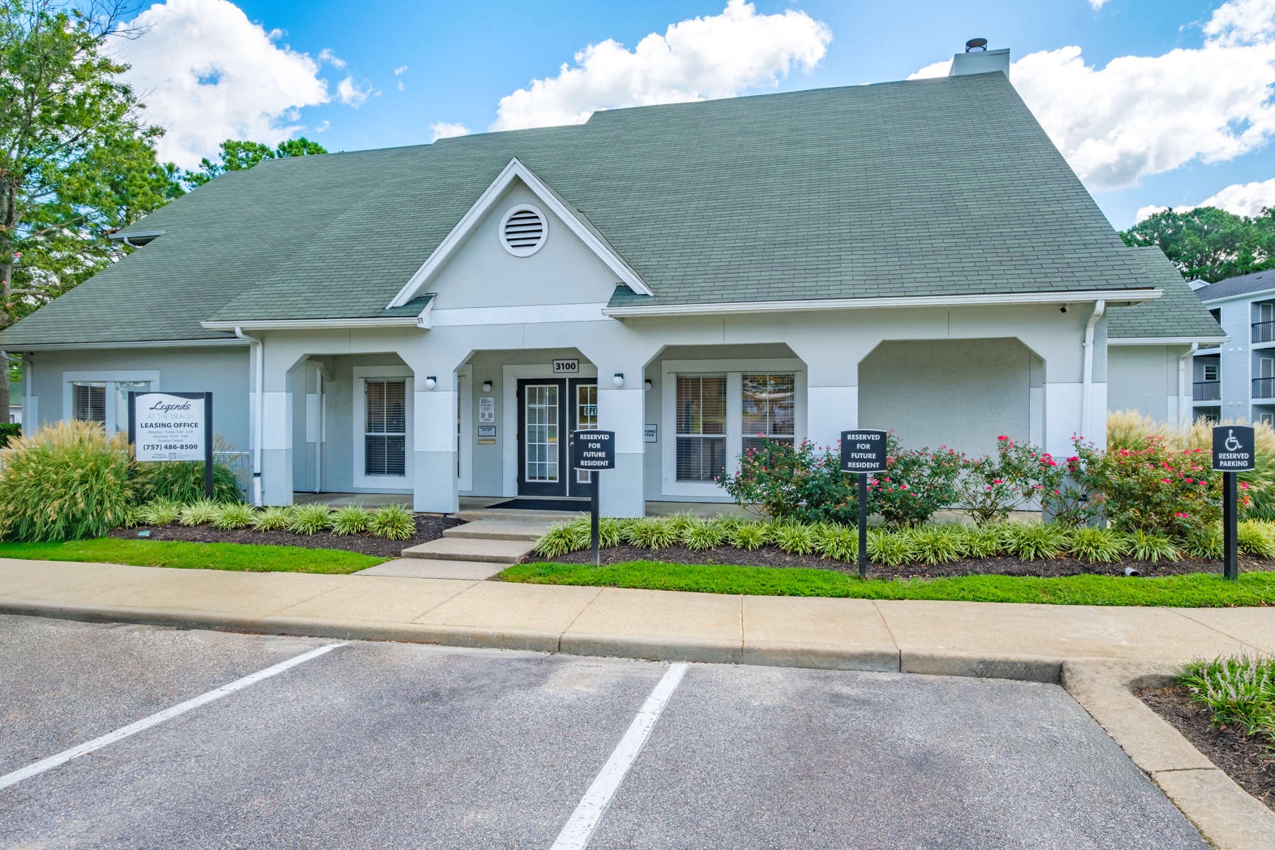 Leasing office and landscaped arrival at Legends at the Beach