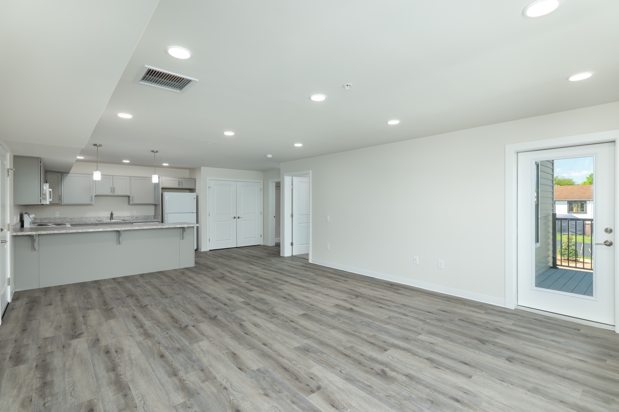 Empty one-bedroom living room at Weldon Place before virtual staging