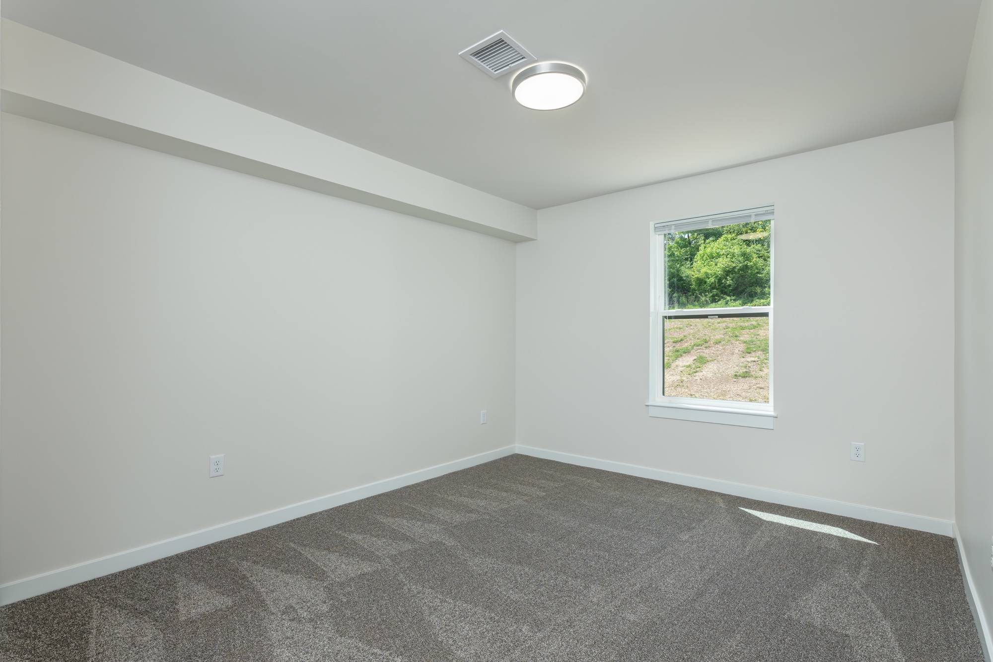 Empty primary bedroom at Weldon Place before virtual staging